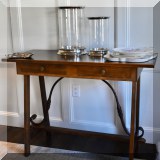 F47. Console table with wrought iron braces. 32”h x 43”w x 19”d 